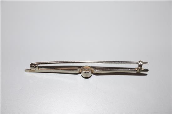 A white metal and solitaire diamond set bar brooch, 56mm, gross 3.3 grams.